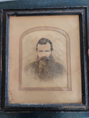 Framed portrait sketch of a bearded man in a frock coat, found under decades of dust in an attic on Klueplaas...