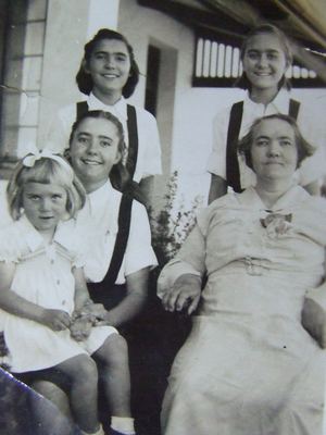 Catharina Isabella van der Merwe, born Bruijn (1894-1953), called KITTIE, on a farm stoep with four of her...