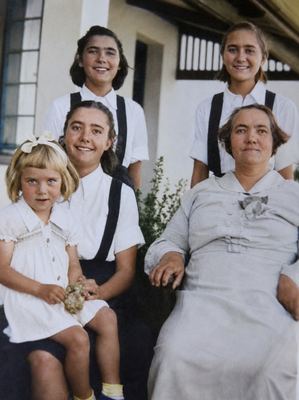 Catharina Isabella van der Merwe, born Bruijn (1894-1953), called KITTIE, on a farm stoep with four of her...