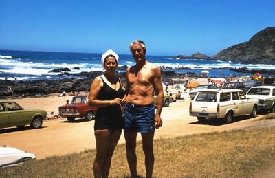 GERT ANNIS "TOKKIE" OOSTHUIZEN MARINCOWITZ (1919-2003) and MARIA MAGRITHA "RIA" VAN RENSBURG (1928-2019) standing on...