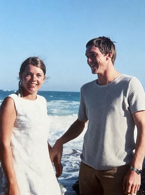 CHRISTIAAN JOHANNES JOUBERT OOSTHUIZEN and CATHARINA "KARIEN" VAN DER MERWE at the sea as a young couple. She stands...