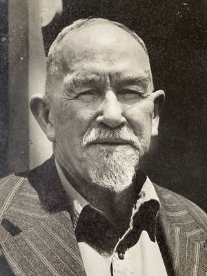 Almero Jacobus Hitge Oosthuizen (1878-1961) in old age: a close portrait in strong sunlight, white moustache and...
